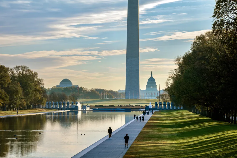 Alt Text: Vibrant sunrise over the National Mall in Washington DC