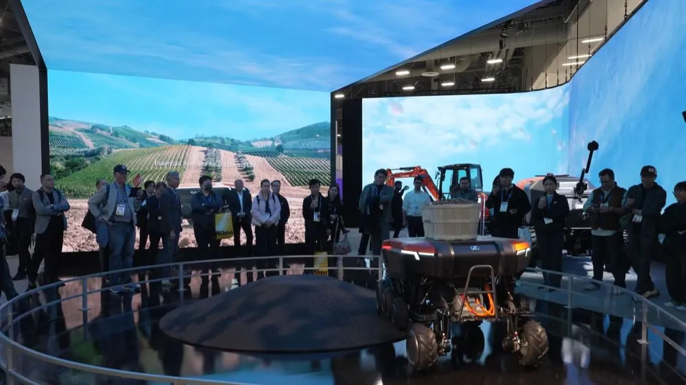 ALT Text: a big display with people surrounding  